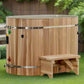 Cedar wood cold plunge barrel with metal bands and integrated bench, displayed in backyard setting
