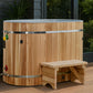 Cedar wood cold plunge barrel with metal bands and light blue interior, featuring matching wooden step stool, on outdoor deck