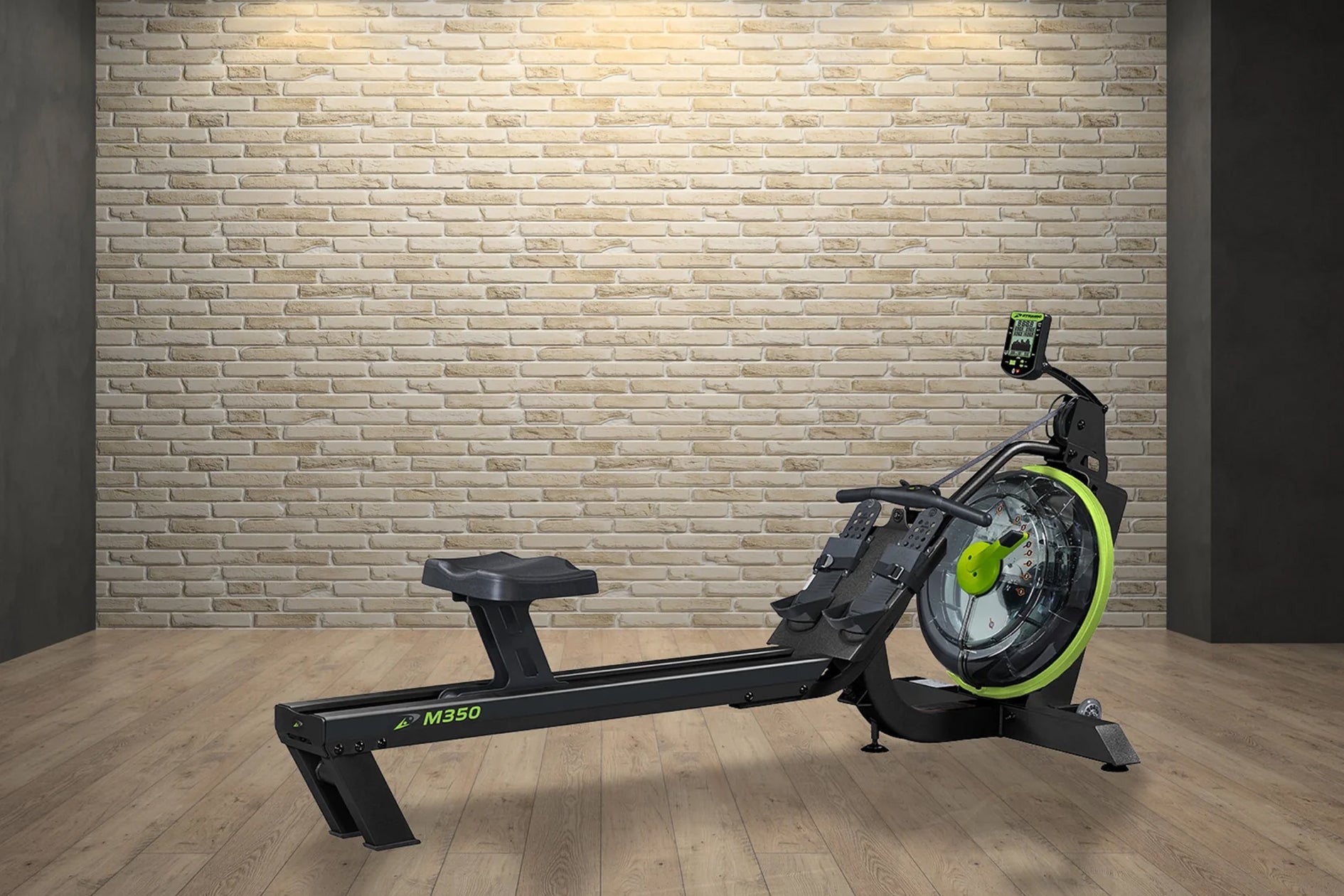 Black and neon yellow rowing machine with digital display, shown on wooden floor against brick wall