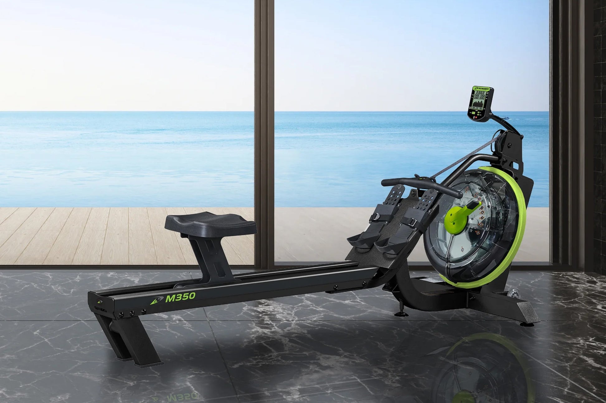 Black and neon yellow magnetic rowing machine with digital display, positioned indoors overlooking ocean view