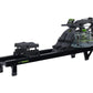 Black Dynamic Fluid S660 rowing machine with digital monitor, green accents, and water resistance chamber on white background