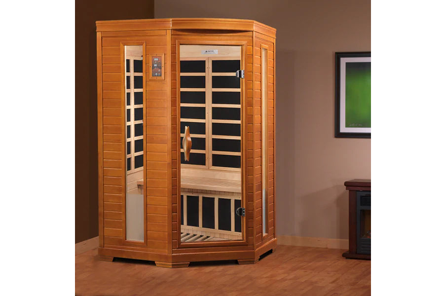 Two-person infrared sauna with golden cedar wood construction, glass doors with black interior panels, digital control panel,