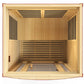 Natural hemlock wood infrared sauna with two bench seats, black vents, and dark honey finish, interior view from above