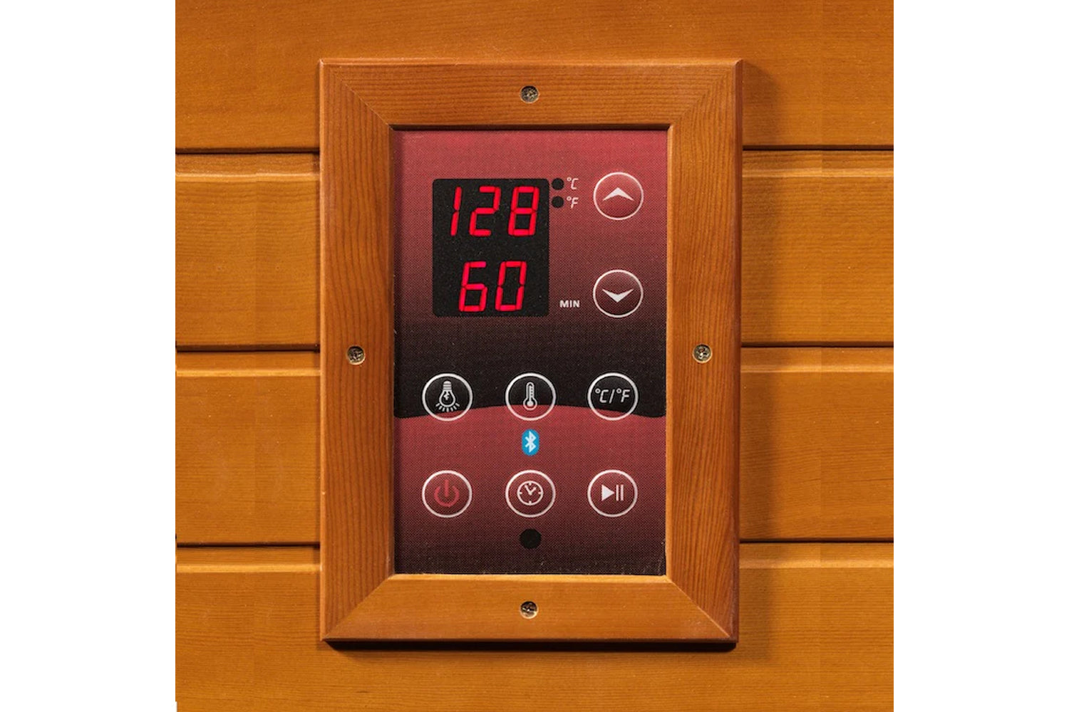 Digital control panel with wooden frame mounted on sauna, displaying 128°F temperature and 60 minutes, featuring red LED disp