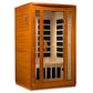 Dark honey hemlock wood infrared sauna with glass door and black interior panels, two-person capacity on white background