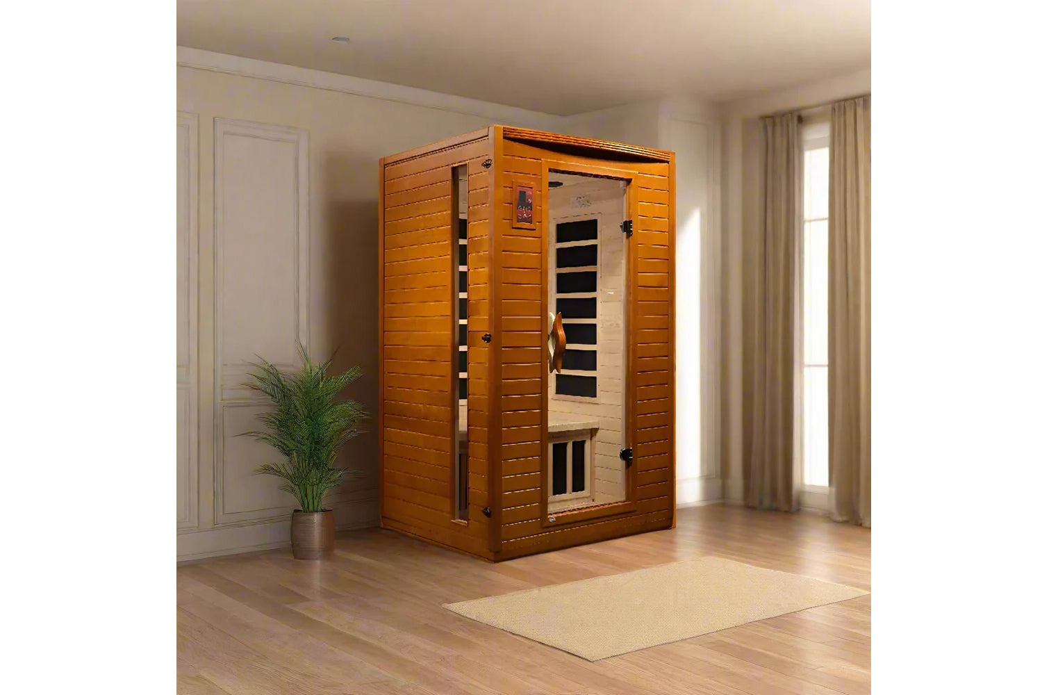 Golden cedar 2-person infrared sauna with glass door and black interior heating panels, shown in bright room setting