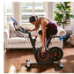 Woman in burgundy tank top using black Echelon Smart Connect stationary bike with red accent wheel in bright living room