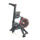 Black and red connected rowing machine with digital display and resistance wheel, viewed from side angle on white background
