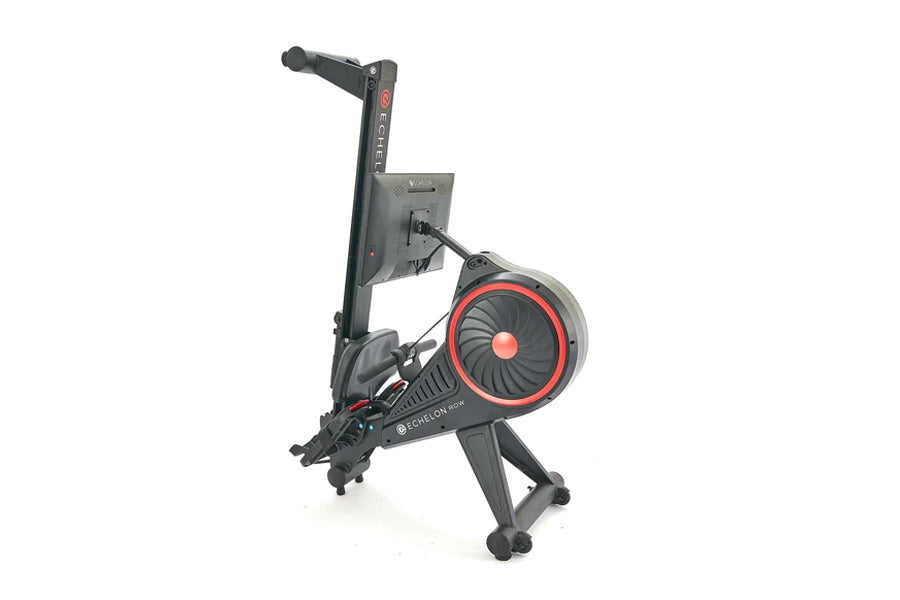 Black and red connected rowing machine with digital display and resistance wheel, viewed from side angle on white background