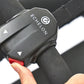 Black Echelon handlebar control unit with red accent buttons held in hand, mounted on rowing machine strap
