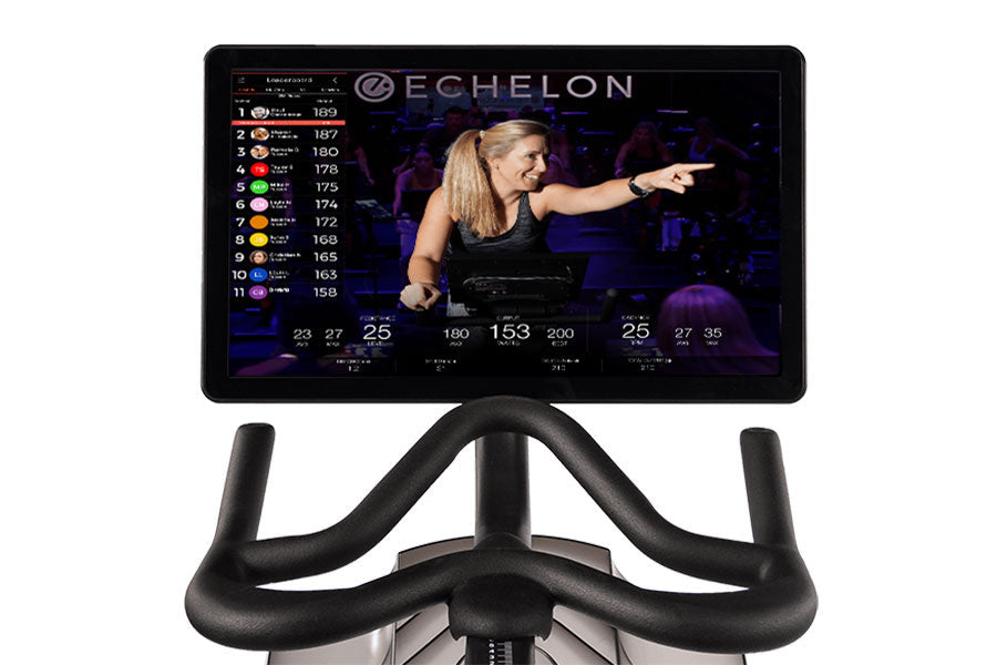 Echelon Smart Connect Bike EX-5s-22 with black curved handlebars and display screen showing live fitness class