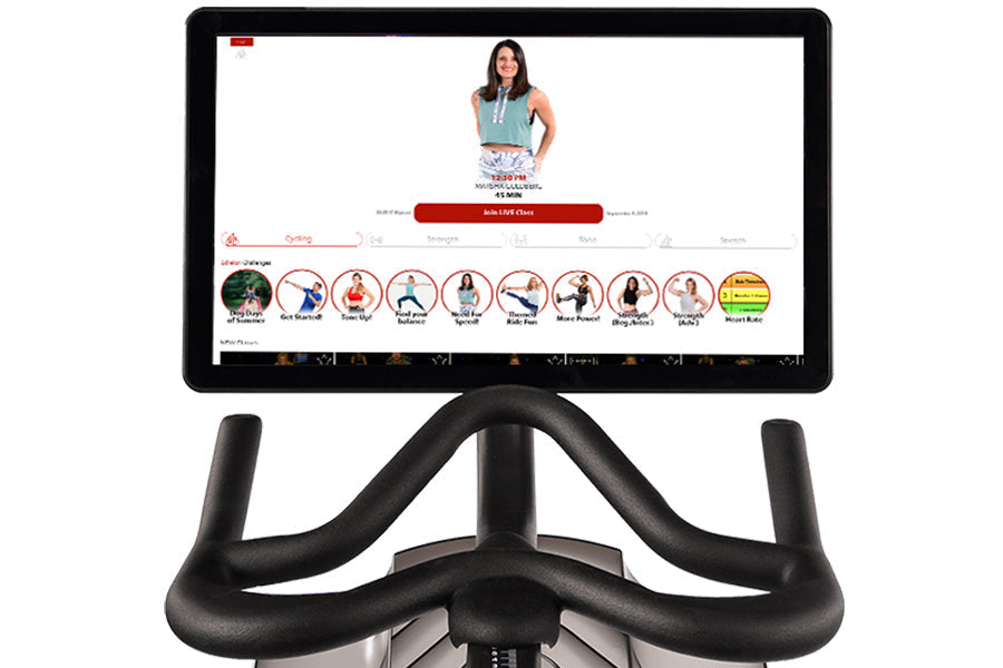 Echelon Smart Connect Bike EX-5s-22 with black curved handlebars and digital display screen showing fitness classes