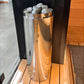 Harvia Cilindro electric sauna heater with stainless steel cylindrical body and decorative patterned rim, filled with gray he