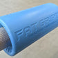 Blue foam barbell grip adapter with "Fat Gripz" branding on metal bar, designed to increase grip thickness for strength train