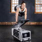 Woman in white tank and black pants using white and black weight bench in industrial gym setting