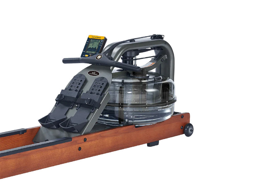 FluidRower Viking Pro V rowing machine with brown wood base, black handlebar, digital monitor, and transparent water tank on 