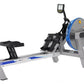 FluidRower E520 Evolution commercial rowing machine with gray frame, blue accents, digital monitor, and black footrest on whi