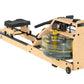 Natural wood and black fluid rowing machine with black padded seat and handle, clear water resistance chamber with yellow acc