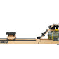 Viking 2 Plus Select fluid rower with light wood frame, black seat, and water resistance tank on white background