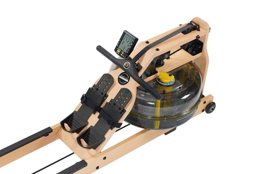 FluidRower Viking 2 Plus Select rowing machine with natural wood frame, black footplates, digital monitor, and clear fluid re