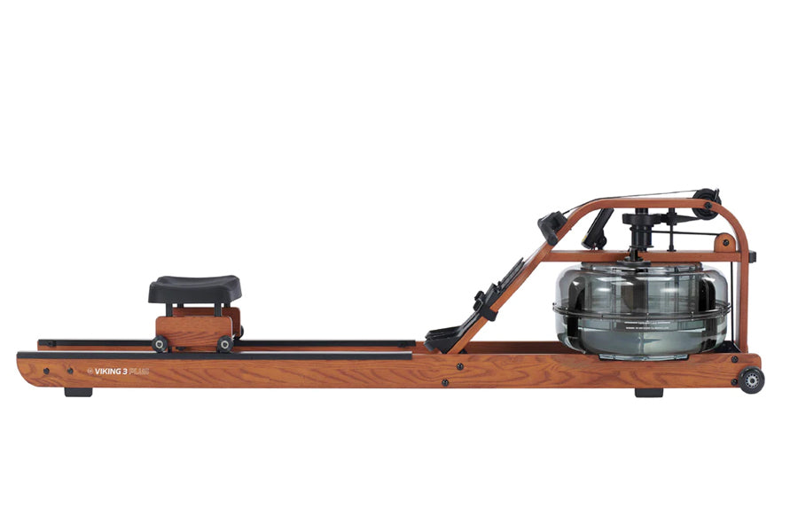 Viking 3 Plus brown fluid rower with wooden frame, black seat, and water resistance tank, side view on white background