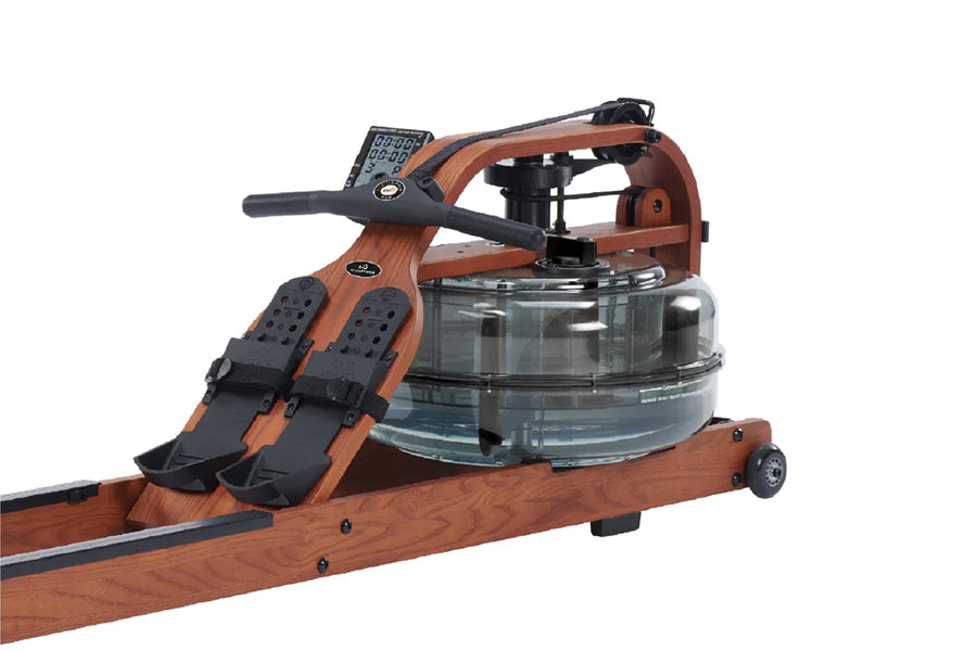 Brown wood frame rowing machine with black handle, digital monitor, and transparent water resistance tank on white background