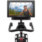 Black stationary bike with curved handlebars, red seat, and mounted display screen showing cyclist in mountain landscape on w