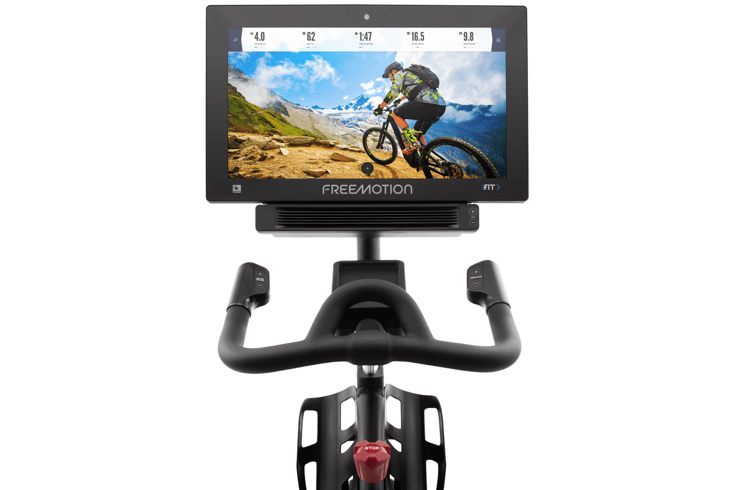 Black stationary exercise bike with curved handlebars and tablet display screen showing mountain biker on trail, viewed from 