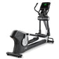 Black and white Freemotion e10.9b elliptical machine with digital display console showing green metrics on white background