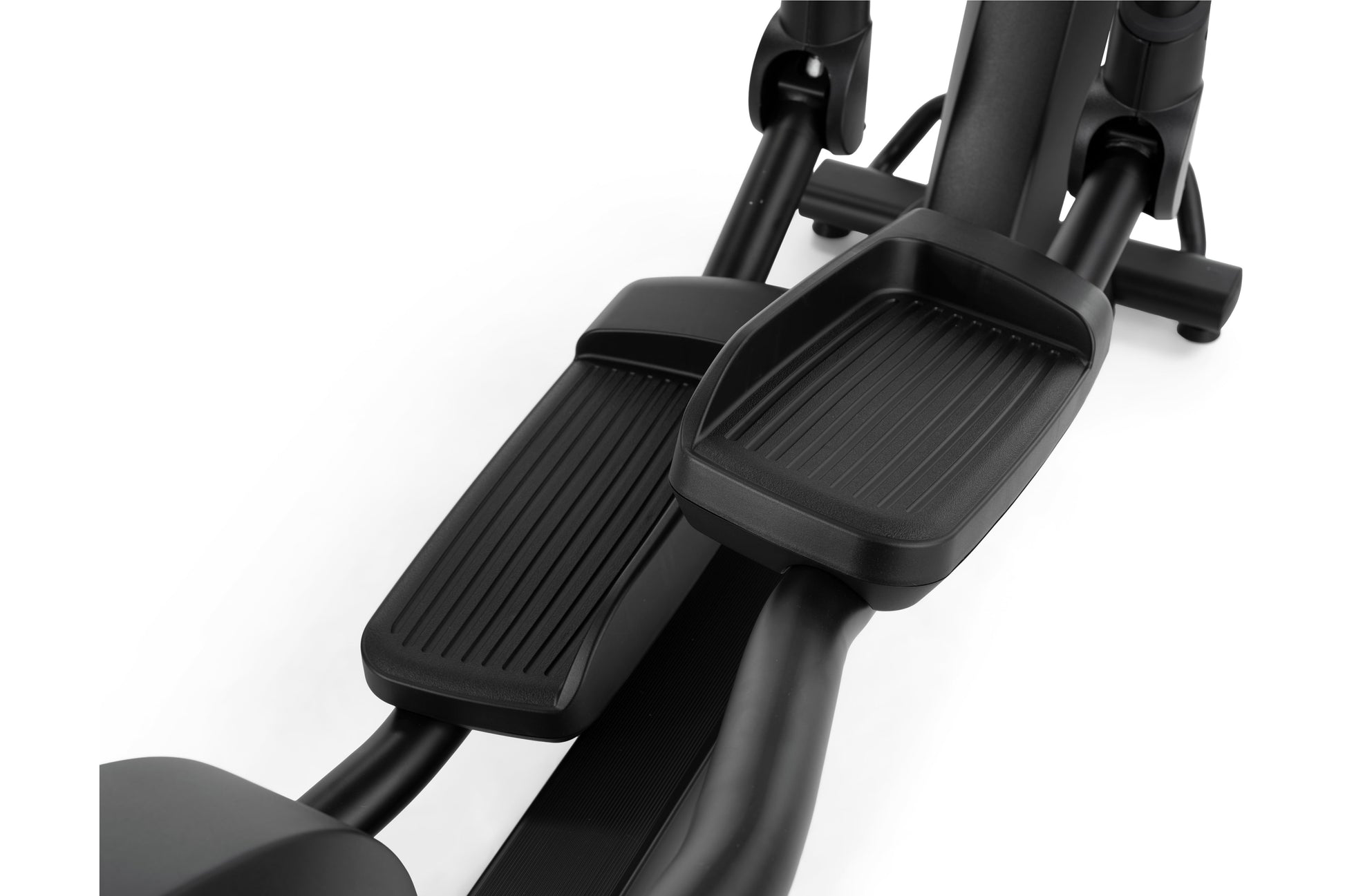 Black elliptical machine with ribbed foot pedals and adjustable stride, shown at angle on white background