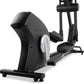Black and silver Freemotion e10.9b elliptical machine with digital display and foot pedals on white background