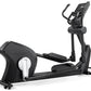 Black Freemotion elliptical machine with digital console, curved handles, and foot pedals on white background