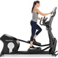 Woman using black Freemotion e22.9 elliptical machine with digital display, worn by model on white background