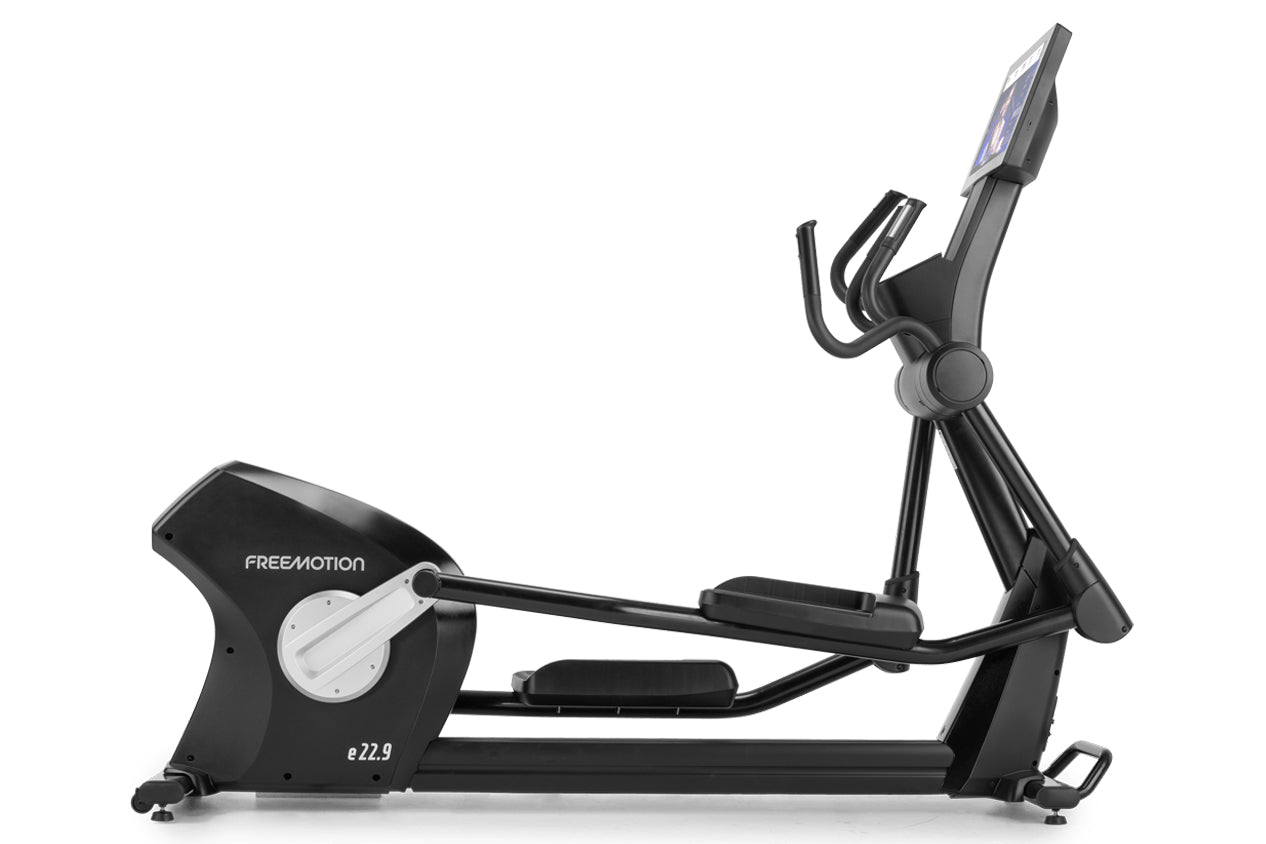 Freemotion e22.9 black elliptical machine with digital display console and dual handles on white background