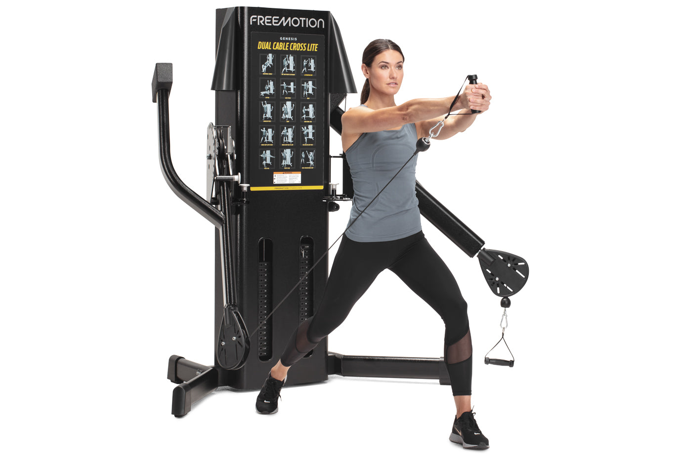 Freemotion Genesis Dual Cable Cross Lite machine in black with woman demonstrating chest fly exercise movement
