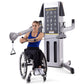 Woman in wheelchair using silver and black Freemotion dual cable cross machine with exercise diagram display, demonstrating u