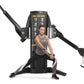 Woman using black Freemotion Genesis Dual Cable Cross machine with dual adjustable arms and instruction panel, shown on white