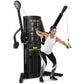 Black Freemotion Genesis Dual Cable Cross machine with dual adjustable pulleys, shown with model demonstrating exercise techn