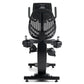 Black recumbent exercise bike with digital console displaying metrics, padded seat, dual handles, and foot pedals on white ba