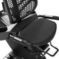 Black and white recumbent exercise bike with grid fan, padded seat, arm handles, and control panel on white background