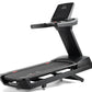 Black Freemotion treadmill with digital console display, gray accents, and red indicator lights on white background