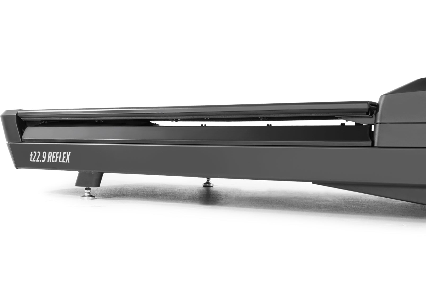 Black t22.9 REFLEX treadmill with curved running surface and control panel, side view on white background
