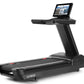 Black Freemotion t22.9 REFLEX treadmill with integrated touchscreen display showing workout content, wide running belt, and s