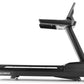 Black motorized treadmill with digital console, adjustable incline, and cushioned running deck on white background