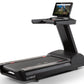 Black Freemotion t22.9 REFLEX treadmill with running deck, digital console displaying scenic landscape, and tablet holder on 