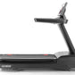 Black treadmill with digital display console on adjustable arm, red accent details, labeled t22.9 REFLEX on running belt, on 