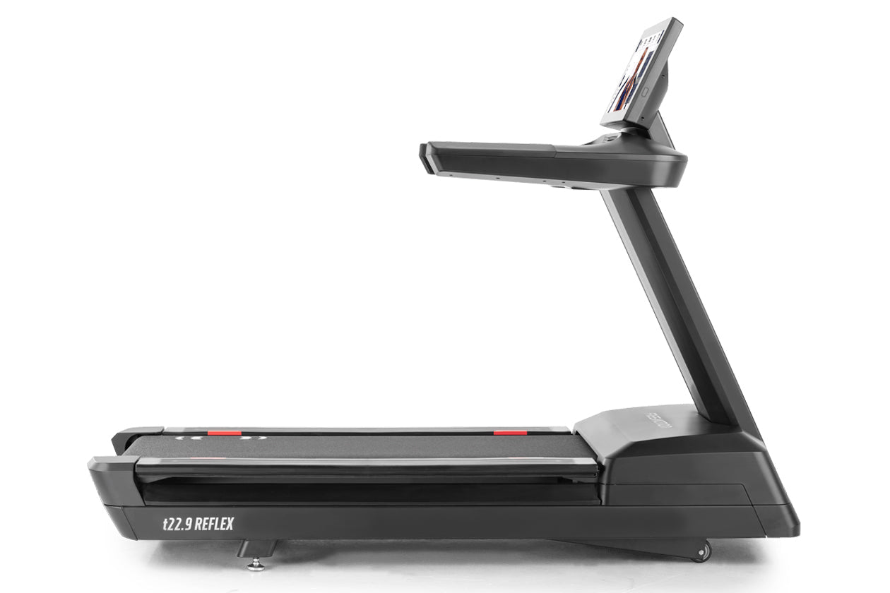 Black treadmill with digital display console on adjustable arm, red accent details, labeled t22.9 REFLEX on running belt, on 