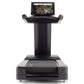 Black Freemotion treadmill with digital display monitor mounted on top showing landscape scenery, featuring wide running deck