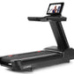 Black Freemotion t22.9 REFLEX treadmill with integrated tablet display mounted on upright console, shown on white background