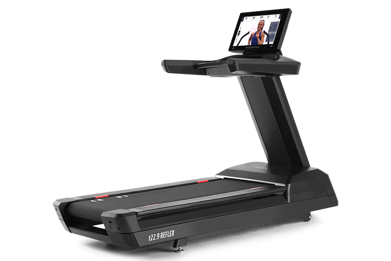 Black Freemotion t22.9 REFLEX treadmill with integrated tablet display mounted on upright console, shown on white background